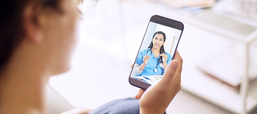 telehealth woman speaking to nurse on smartphone