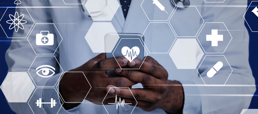 A doctor stands behind icons signifying health apps
