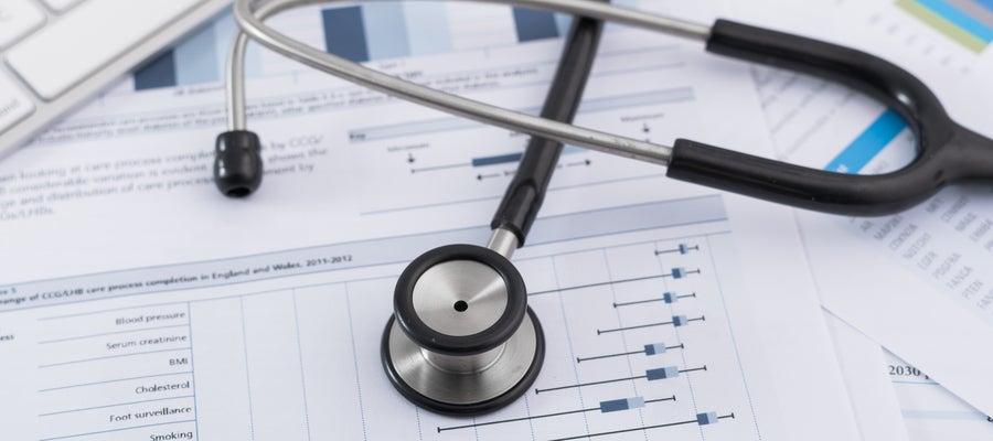 Stethoscope on financial documents