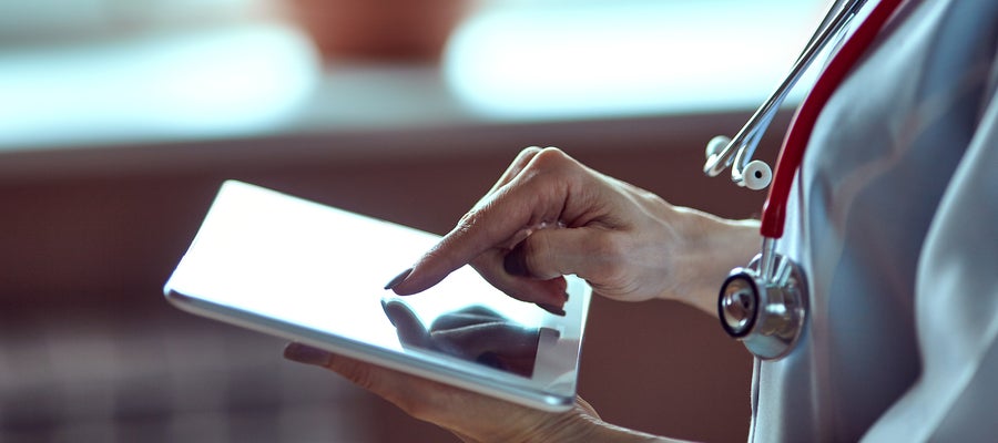 finger tapping on portable tablet