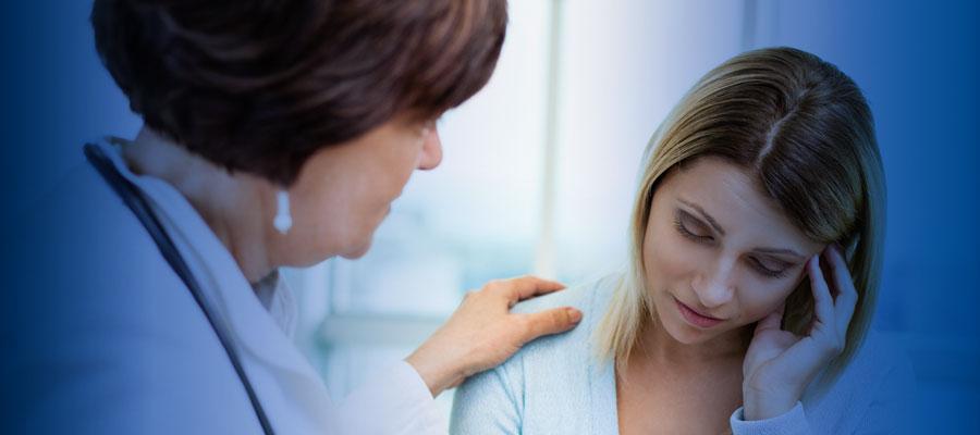 A patient dealing with drug usage issues and suicidal ideation talks with a clinician.