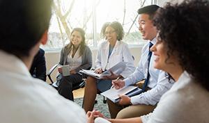 Stock group meeting smiling notebooks doctors executives